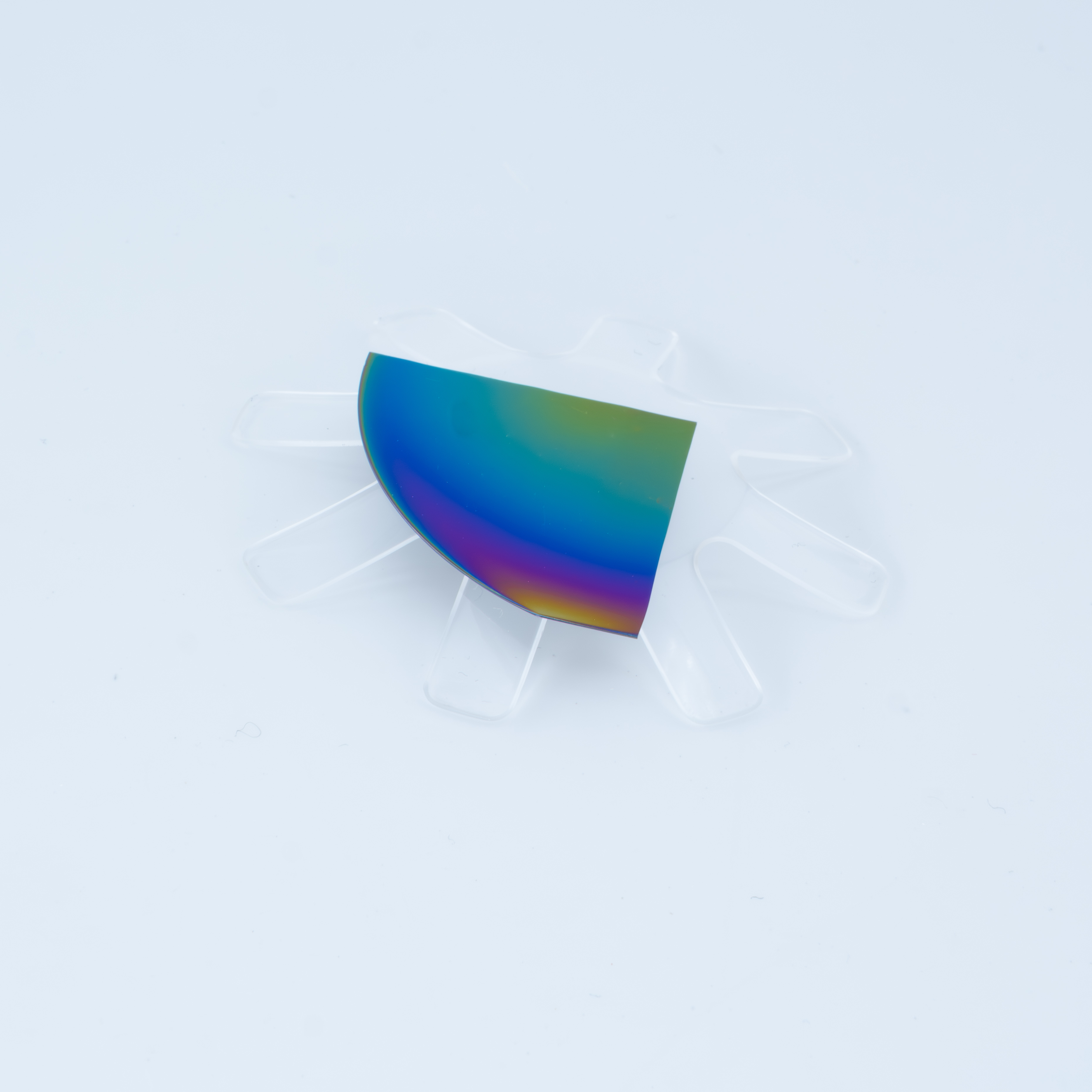 Iridescent rare-earth-doped yttrium oxide thin film on a partial wafer